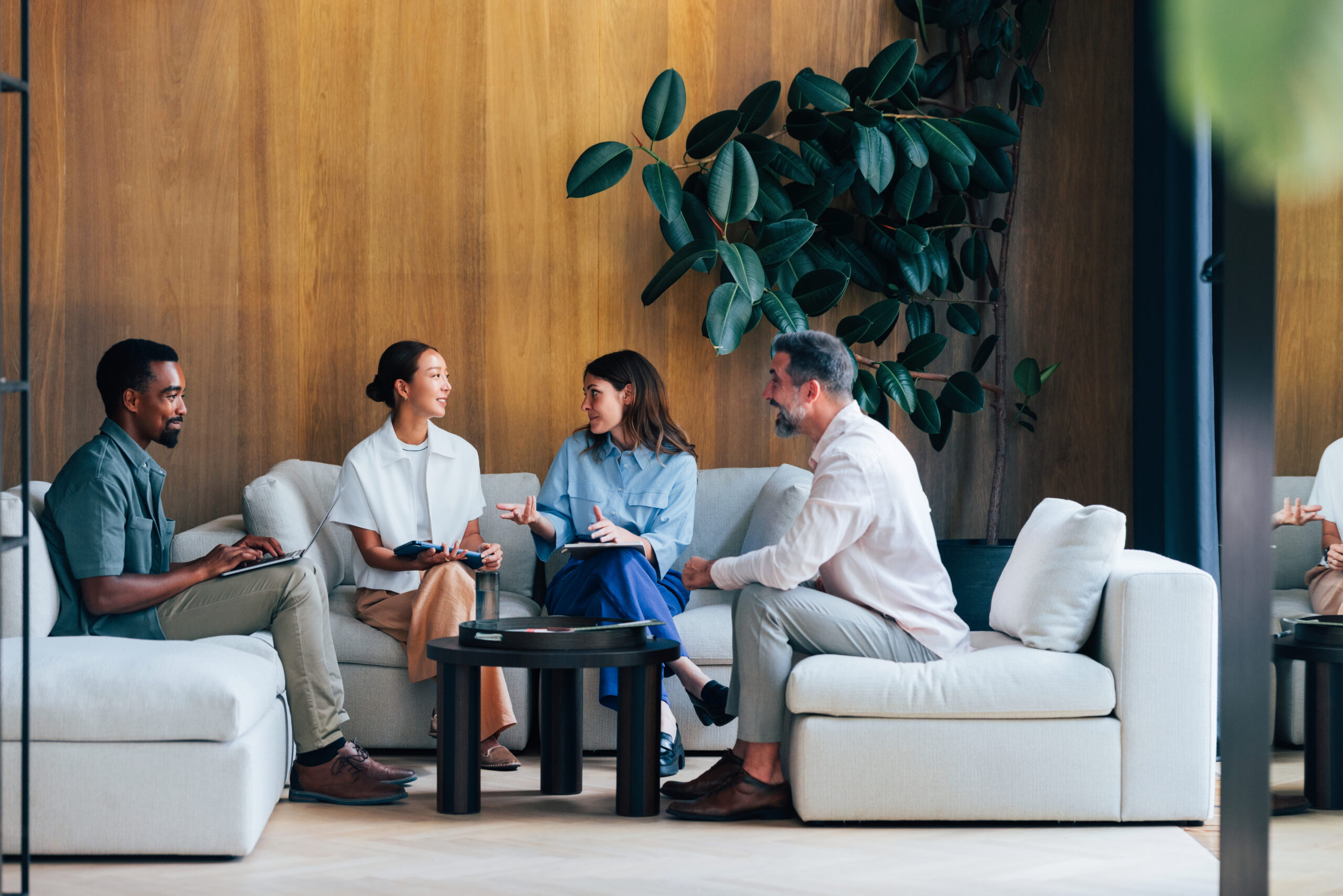 Group of Professionals Engaging in a Team Meeting in a Modern Environment